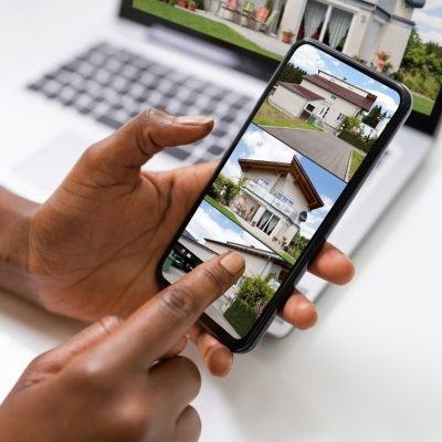person-looks-for-house-online
